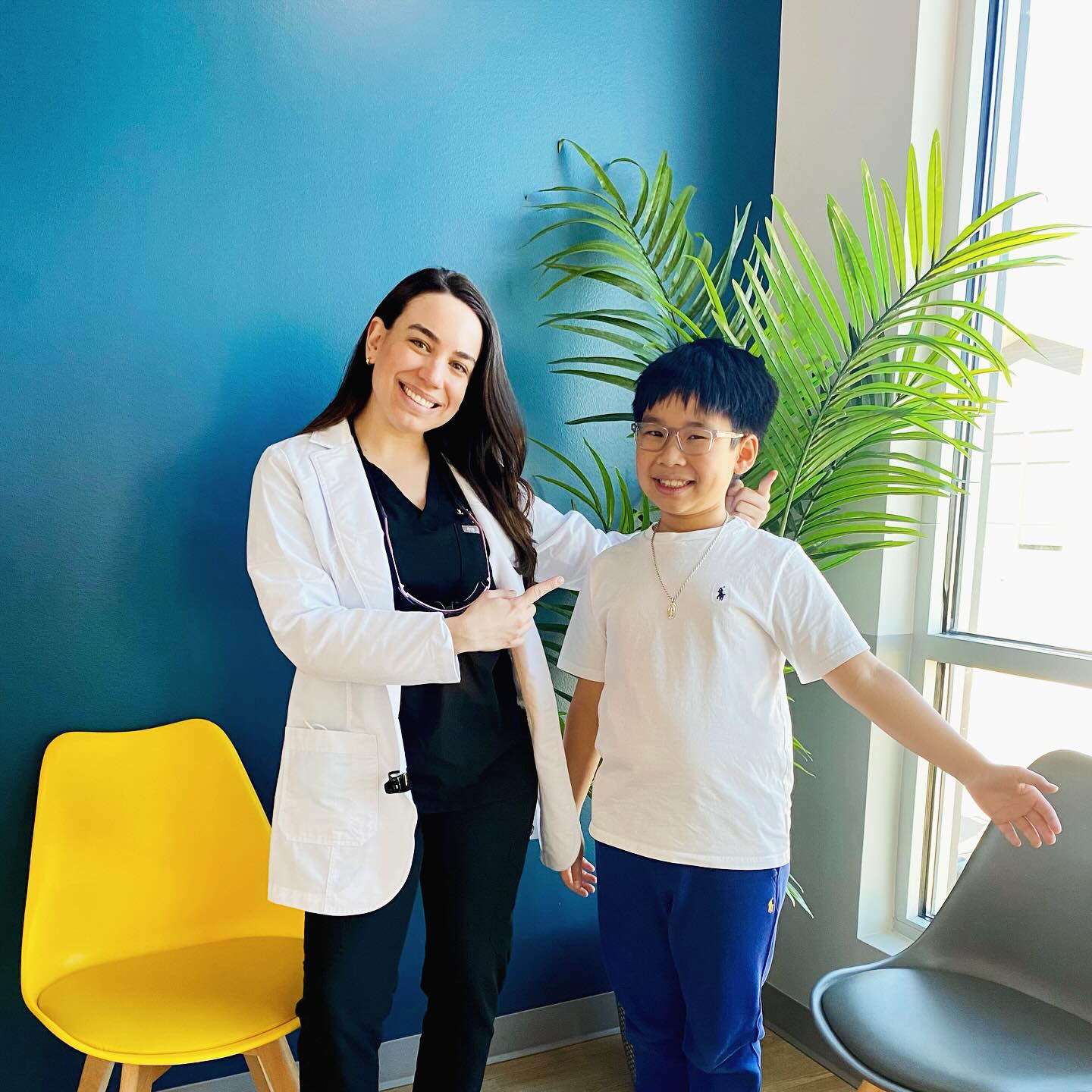 young patient laughing with doctor